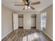 Bedroom with dual closets and hardwood floors for added appeal at 11 Grove Ln, Hampton, GA 30228