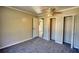 Bedroom with carpeted flooring and a ceiling fan, offering a comfortable and inviting space at 11 Grove Ln, Hampton, GA 30228
