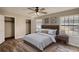 Bedroom showcasing a ceiling fan, hardwood flooring, and closet space at 11 Grove Ln, Hampton, GA 30228
