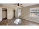Bedroom with closets, natural lighting, and hardwood floors at 11 Grove Ln, Hampton, GA 30228