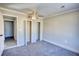 Bedroom with carpeted flooring and a ceiling fan, offering a comfortable and inviting space at 11 Grove Ln, Hampton, GA 30228