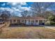 Well-maintained brick home with a cozy porch and neat landscaping, offering classic curb appeal at 11 Grove Ln, Hampton, GA 30228