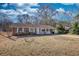 Charming brick home with a well-maintained lawn and inviting front porch at 11 Grove Ln, Hampton, GA 30228