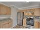 Modern kitchen featuring stainless steel appliances and granite countertops, well lit at 11 Grove Ln, Hampton, GA 30228