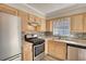 Updated kitchen featuring granite countertops and stainless steel appliances, new backsplash, well lit at 11 Grove Ln, Hampton, GA 30228