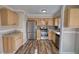 Updated kitchen with stainless steel appliances, stone backsplash, and wood cabinets at 11 Grove Ln, Hampton, GA 30228