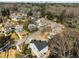 Aerial view of the home within a wooded neighborhood with a distant skyline at 2150 Essex Sw Ave, Atlanta, GA 30311