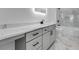 Modern bathroom with marble countertops, vanity, and tiled shower and tub at 2150 Essex Sw Ave, Atlanta, GA 30311