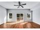 Bedroom with natural light and ceiling fan leads to outdoor deck at 2150 Essex Sw Ave, Atlanta, GA 30311
