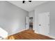 Bedroom with hardwood floors, gray walls, an open doorway and closet door, and natural light at 2150 Essex Sw Ave, Atlanta, GA 30311