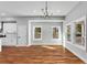 Sun-filled dining area with hardwood floors and views of the porch and outside trees at 2150 Essex Sw Ave, Atlanta, GA 30311