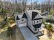 Aerial view of new construction showing two-story home with gray siding, black roof, and attached garage at 2150 Essex Sw Ave, Atlanta, GA 30311