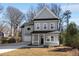Charming gray two-story home with a welcoming front porch and well-manicured lawn at 2150 Essex Sw Ave, Atlanta, GA 30311