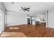 Living room with hardwood floors, recessed lighting, a ceiling fan, and a view of the modern kitchen at 2150 Essex Sw Ave, Atlanta, GA 30311