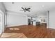 Expansive living room with open layout connecting to a modern kitchen featuring an island and stainless appliances at 2150 Essex Sw Ave, Atlanta, GA 30311