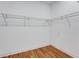 Walk-in closet with white walls, wood flooring, and wire shelving system at 2150 Essex Sw Ave, Atlanta, GA 30311
