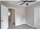 Neutral bedroom featuring new flooring, a ceiling fan, and a closet at 2945 Catalina Dr, Decatur, GA 30032