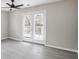 Light-filled bedroom with double doors leading to the deck, providing seamless indoor-outdoor living at 2945 Catalina Dr, Decatur, GA 30032