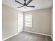 This bedroom has a window with mini blinds, hardwood floors, and a ceiling fan at 2945 Catalina Dr, Decatur, GA 30032