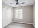 Well-lit bedroom featuring modern vinyl flooring, a double door closet, and a large window at 2945 Catalina Dr, Decatur, GA 30032