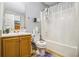 Bathroom featuring a vanity, toilet, and shower with clear glass doors for a clean and modern aesthetic at 5803 Star Flower Dr, Ellenwood, GA 30294