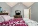 Cozy bedroom featuring a vaulted ceiling, soft lighting and comfortable queen size bed at 5803 Star Flower Dr, Ellenwood, GA 30294