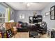 Bedroom with a work area; features natural light from the window, gray walls, and carpeted flooring at 5803 Star Flower Dr, Ellenwood, GA 30294