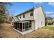 Rear exterior view of the house showing siding, patio, roof line, and backyard at 5803 Star Flower Dr, Ellenwood, GA 30294