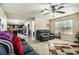 Relaxing living room featuring comfortable seating, neutral walls, and an archway view to the kitchen at 5803 Star Flower Dr, Ellenwood, GA 30294