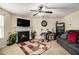 The living room has a fireplace, neutral carpet, and is brightly lit at 5803 Star Flower Dr, Ellenwood, GA 30294