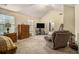Spacious main bedroom with a vaulted ceiling, carpeted flooring, and a sitting area by the window at 5803 Star Flower Dr, Ellenwood, GA 30294