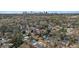 Wide aerial view showing homes in a wooded neighborhood with Atlanta skyline in the distance at 1054 Shepherds Ne Ln, Atlanta, GA 30324