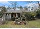 Fenced backyard with a patio dining set and mature landscaping at 1054 Shepherds Ne Ln, Atlanta, GA 30324