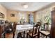 Traditional dining room featuring a wooden table and chairs, with natural light and hardwood floors at 1054 Shepherds Ne Ln, Atlanta, GA 30324
