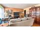Cozy living room with hardwood floors, ample seating, and a decorative china cabinet at 1054 Shepherds Ne Ln, Atlanta, GA 30324
