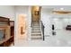Finished basement area with a staircase, white-painted walls, and a glimpse of a bathroom at 1300 Village Oaks Ln, Lawrenceville, GA 30043