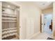 Bright bathroom featuring a tiled floor, built-in shelving, and an open shower with curtain at 1300 Village Oaks Ln, Lawrenceville, GA 30043