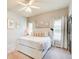 Bright bedroom with a neutral color palette, decor and a large bed at 1300 Village Oaks Ln, Lawrenceville, GA 30043