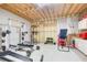 Unfinished gym in the basement area with work out equipment at 1300 Village Oaks Ln, Lawrenceville, GA 30043