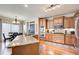 Gourmet kitchen featuring granite countertops, stainless appliances and an adjacent dining area at 1300 Village Oaks Ln, Lawrenceville, GA 30043