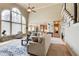 Bright and airy living room with two-story window and open floor plan at 1300 Village Oaks Ln, Lawrenceville, GA 30043