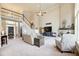 Inviting living room with high ceilings, fireplace, large windows, and an open staircase at 1300 Village Oaks Ln, Lawrenceville, GA 30043