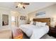 Serene main bedroom with decor, wooden headboard, and ample natural light at 1300 Village Oaks Ln, Lawrenceville, GA 30043