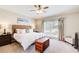 Calm main bedroom with natural light, stylish furnishings, and carpeted floors at 1300 Village Oaks Ln, Lawrenceville, GA 30043