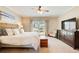 Peaceful main bedroom with a king-sized bed, carpeted floors, and large window at 1300 Village Oaks Ln, Lawrenceville, GA 30043