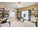 Spacious home office with natural light from a large window, a desk, and ample shelving at 1300 Village Oaks Ln, Lawrenceville, GA 30043