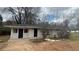 Single-story home featuring a brick facade and a dark roof at 2317 Sheryl Dr, Decatur, GA 30032