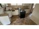 Bright kitchen with granite countertops, stainless steel appliances and a linoleum floor at 2317 Sheryl Dr, Decatur, GA 30032