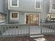 Backyard wooden deck with railings, a sliding glass door leading inside, and a tree at 1063 Riverbend Club Se Dr, Atlanta, GA 30339