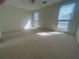 Spacious bedroom featuring neutral carpet and two large windows offering lots of natural light at 1063 Riverbend Club Se Dr, Atlanta, GA 30339